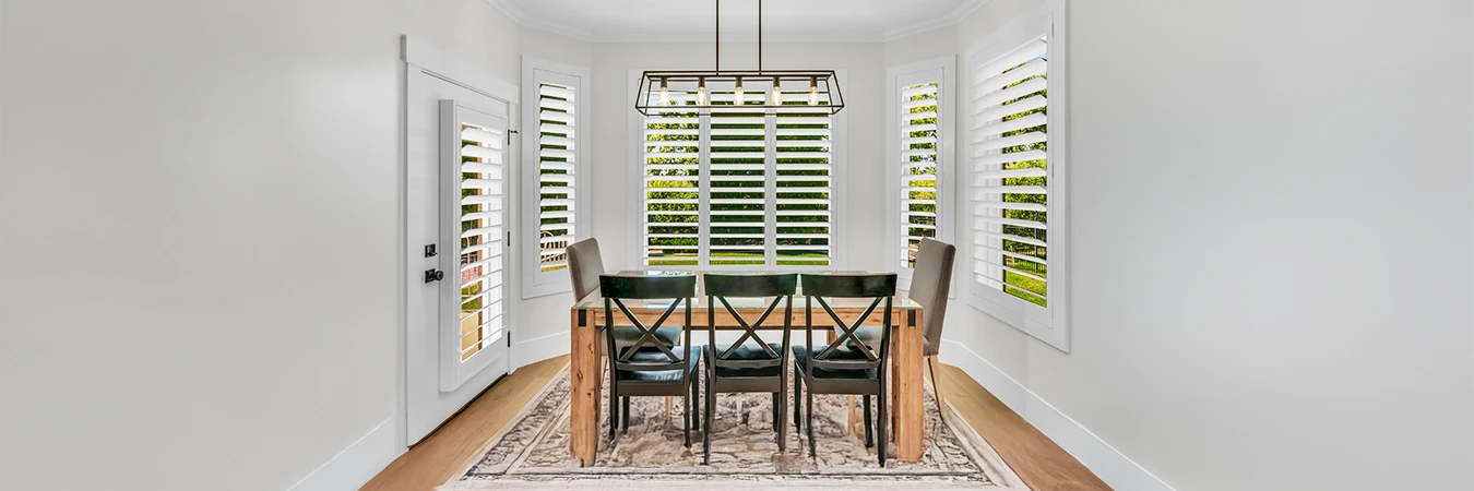 White Polywood shutters on dining room windows