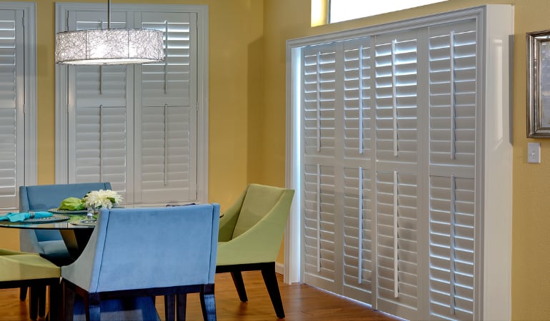 Plantation shutters on a French door act like common window shutters. Patio Doors with Plantation Shutters in Miami