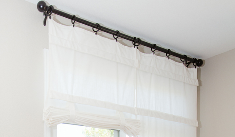 Tumble shades in Miami give your doors privacy versatility and style. White tumble shade on double glass doors